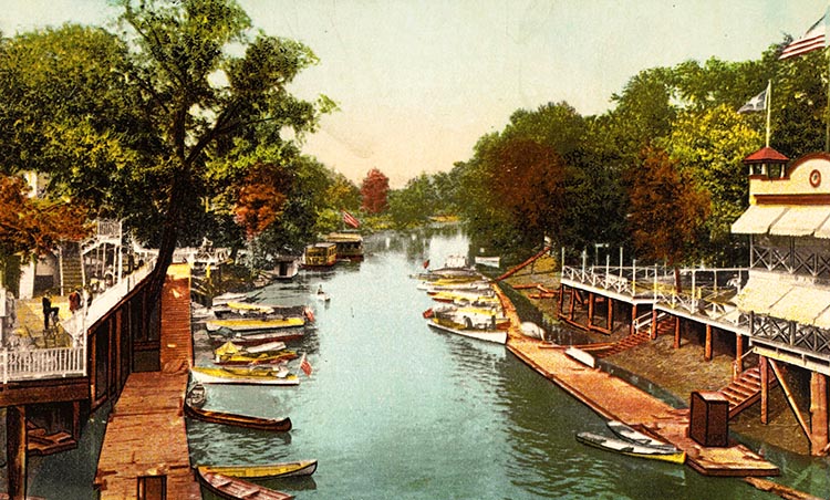 Postcard showing docks, businesses, and watercraft on the Blue River near 15th Street, circa 1912.