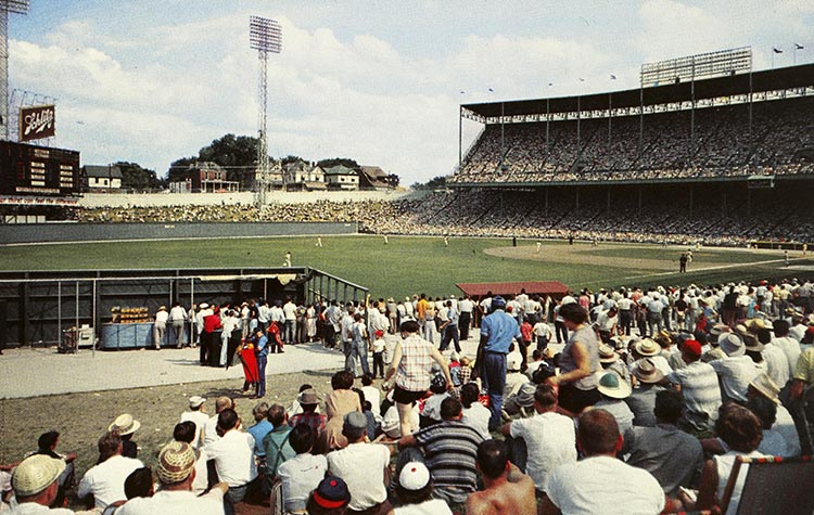 Fans watching a baseball game at Municipal Stadium.