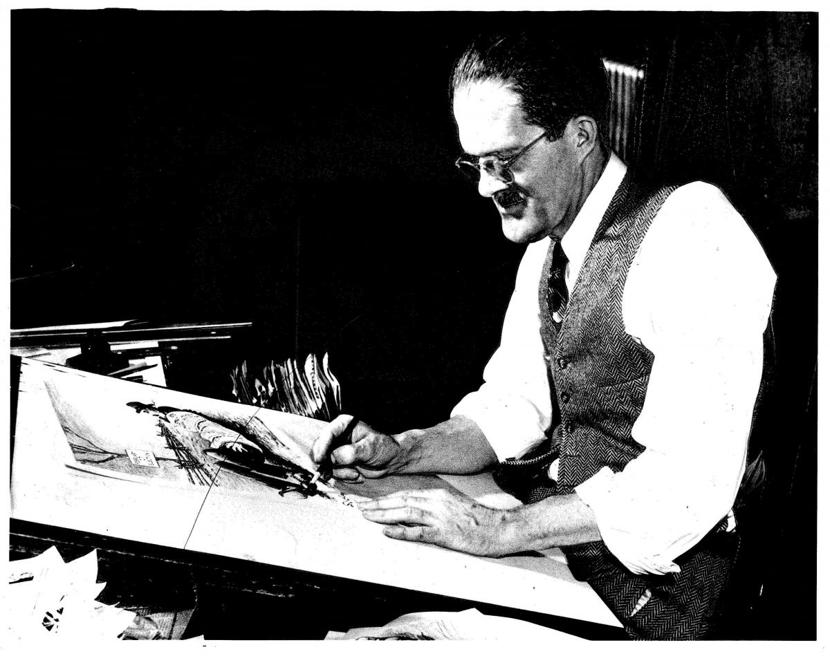 S. J. Ray at his drawing board.