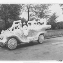 People in Decorated Car