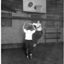 Two Girls Playing Basketball