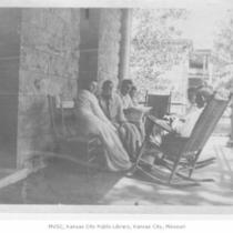 People Seated on Porch