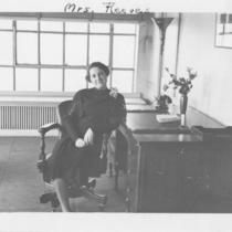 Woman Seated at Desk