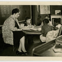 Teacher and Children in Classroom of an Unidentified School