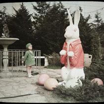 Small Child with Easter Bunny Statue