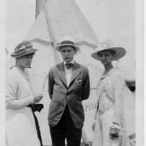 Women and Man In Front of Teepee