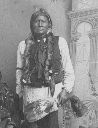Apache chief Dor-con-each-la in traditional dress
